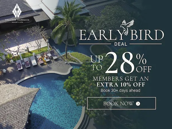 Promotional banner for Andaman Cannacia Resort & Spa showing an aerial view of the beach resort with an Early Bird Deal of up to 28% off and extra 10% off for members